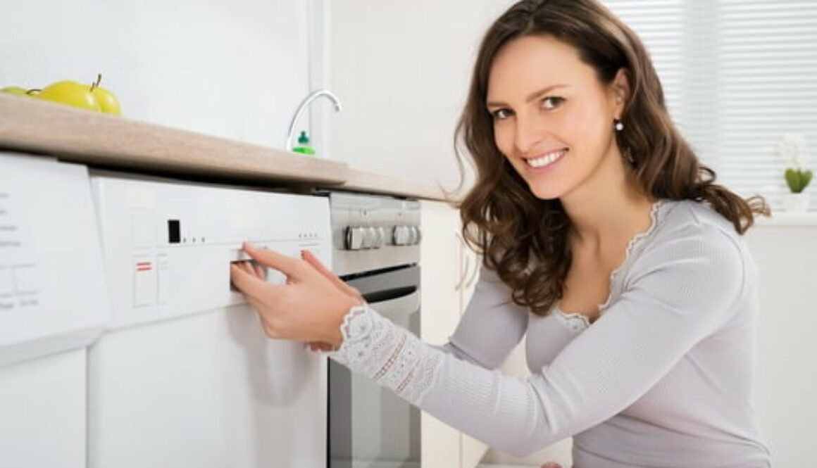 Woman Opening Dishwasher